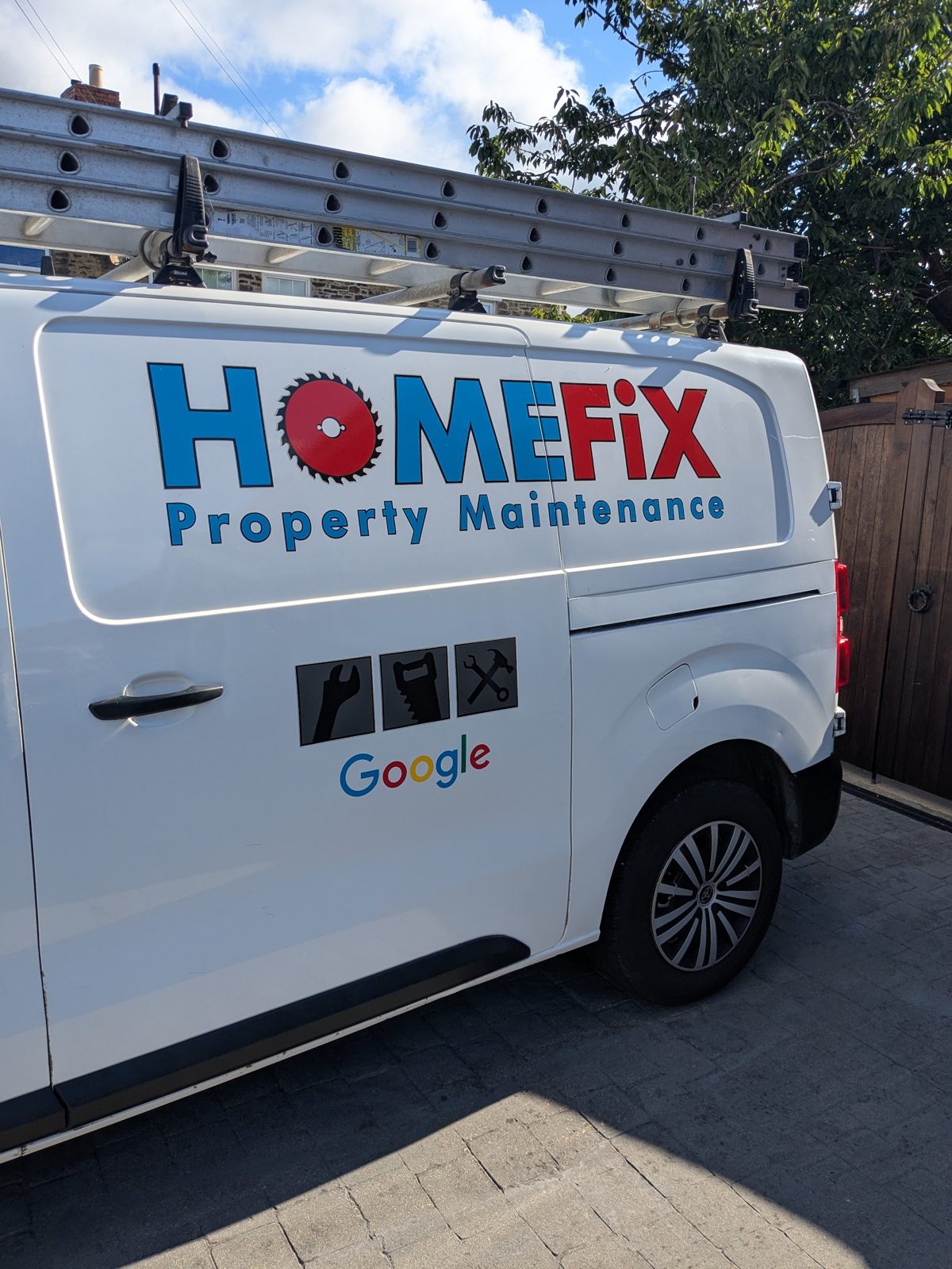The front of the white Home Fix van with the HOMEFiX logo